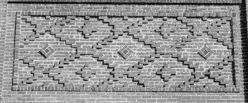 cross pattern of the ceramic tile design resembles the ornamental brick work that was a key feature of the former Union Iron Works Turbine Building, another local National Register historical