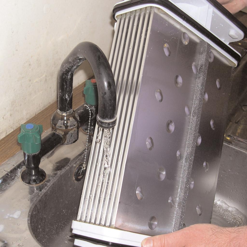 To maintain the efficiency of the dryer regularly check that the condenser is clean. To remove the condenser 1. Remove the kickplate (see page 13). 2.