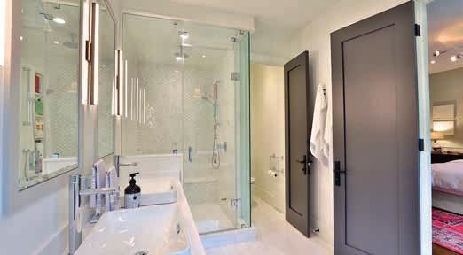 dolomite marble tile floor Separate walk-in shower with bench, rain shower head, marble tile and herringbone marble accent wall and glass enclosure extra large quartz custom niche