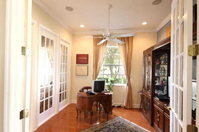 FORMAL DINING AREA- has 11 ceilings, open dining featuring tray ceiling and pillars.