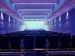 Auditorium Schematic Redesign: Intent: Light to the higher reflectance paint on the upper portion of the walls (80%) Indirect lighting to the ceiling with 6000K Mimic sylight Use direct downlights
