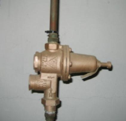 The pressure regulator should be installed immediately downstream of the main shut-off valve.