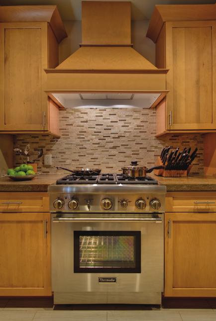 surface with raised pedestal burners. The large oven boasts the fastest 2-hour self-cleaning cycle.