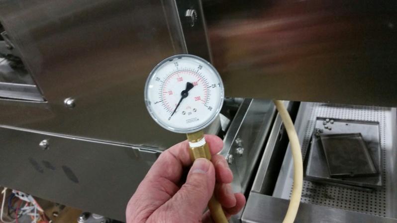 Hold the gauge outside the conveyor