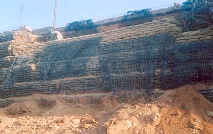 9 m Sagging of bags occurred due to watering Geogrids after wrapping inserted for a length of