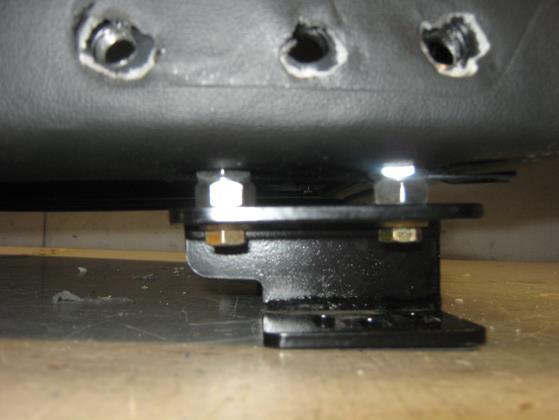 2 Remove the back assembly by removing the four 7/16-20 bolts, two per side, using a 5/8 socket and ratchet as