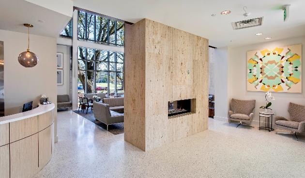 A natural gas, seethrough fireplace and natural walnut panels bring warmth to the reception and waiting areas.