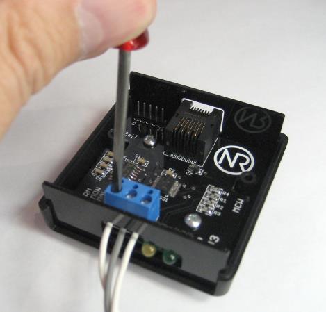 To connect, strip approximately ¼ of insulation from the wire, insert into the screw terminal, and tighten down with a small flat head screwdriver.
