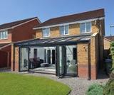 conservatory achieves a great combination of spacious indoor and outdoor living.