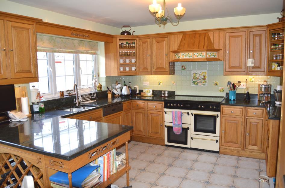 38m), comprising of new granite worktop surfaces, drawers and storage cupboards under, plumbed in dishwasher, fitted Leisure Range cooker with extractor fan over, pattern ceramic tile surrounds,