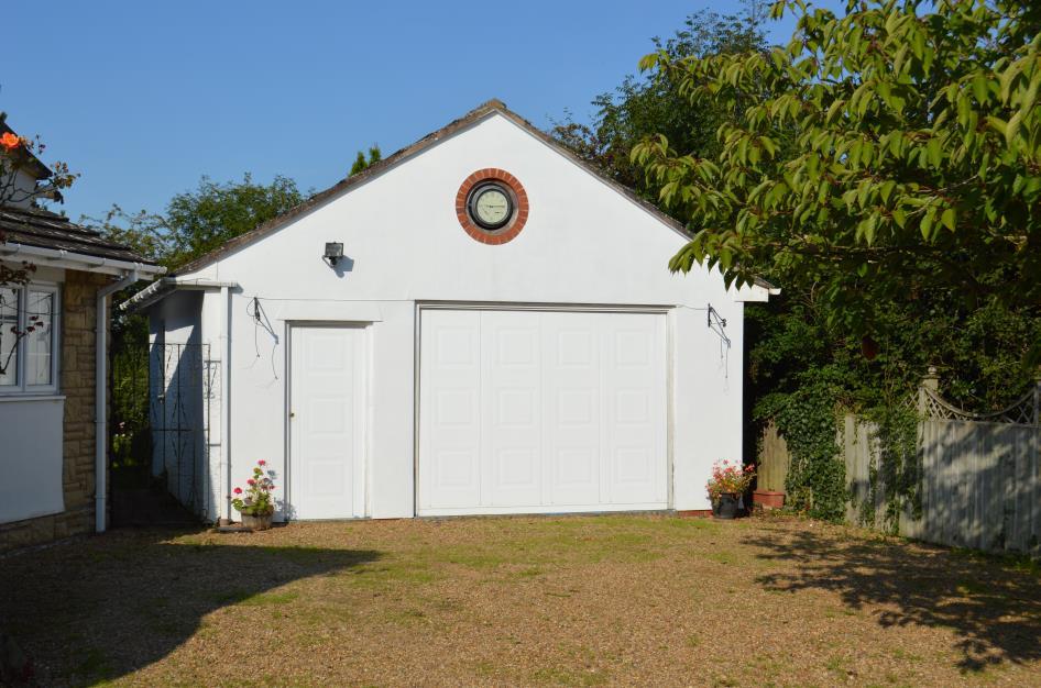 Outside the Property: Detached Double Garage: measuring approximately 22 10m x 17 8 (6.73 x 5.