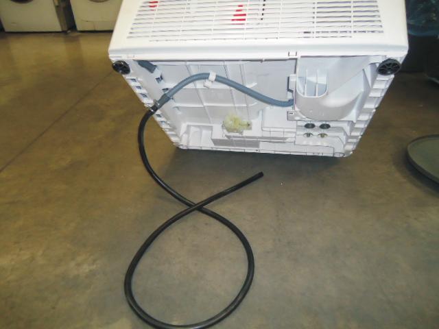 pushing the tumble dryer into position. Fit the Hose as Follows: 1.Tilt the machine backwards. 2.