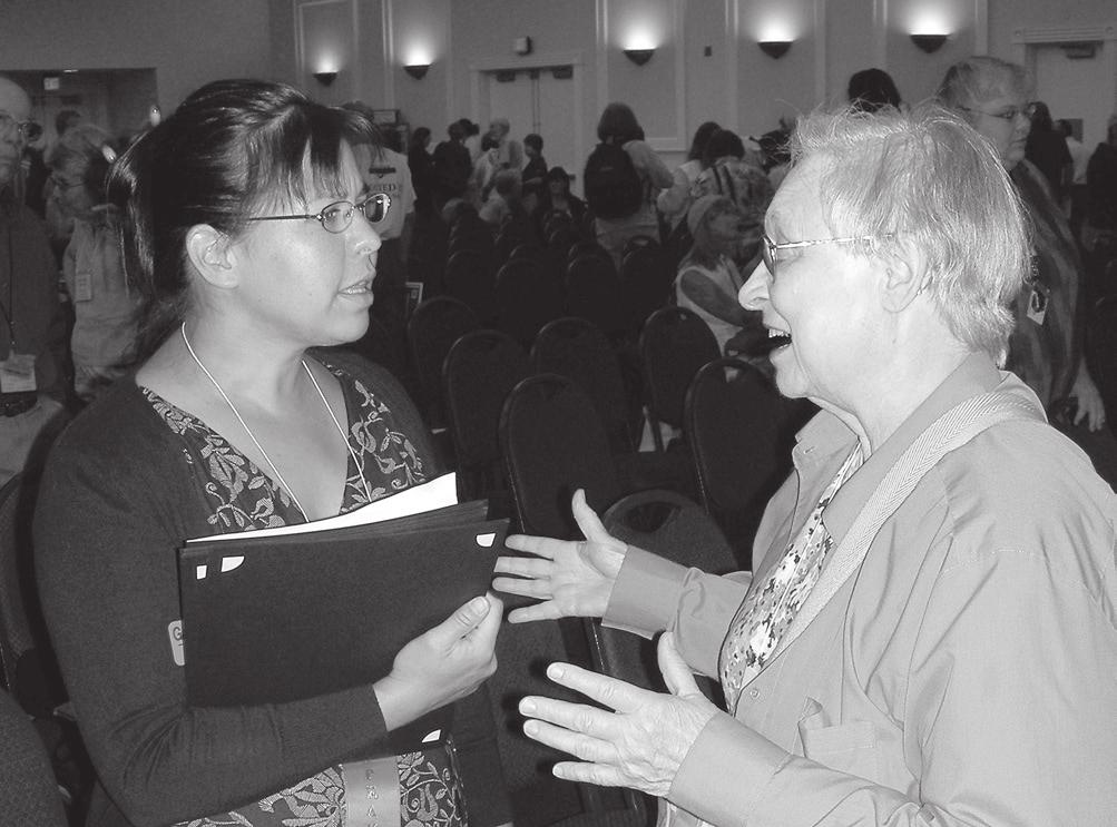 Statewide Master Gardener Program Leader Gail Langellotto chats with a Master Gardener at an event. Oregonized the program to fit our needs.