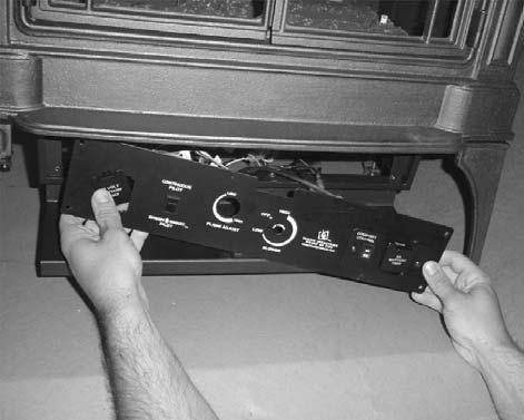 the four screws holding the control panel to the front of the stove (see Figure 3).