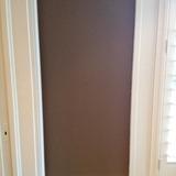 Plaster The living room walls are painted a dark maroon colour and