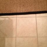 Floors Tile New The kitchen has a tiled floor and it is covered in a