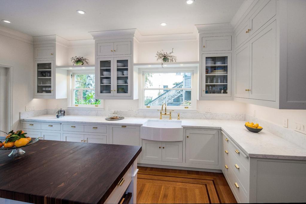After Raising the ceiling back to the original 9 foot height creates more cabinet storage and elevates the