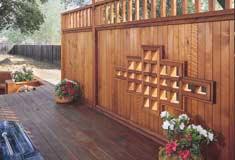 Fence boards were louvered to allow views of the landscape while creating a property line barrier. FENCES Handsome columned fence.