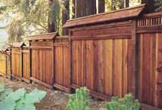 Eye-catching privacy screen. Part of an overall redwood deck project, a Construction Heart/Deck Heart fence shields a spa setting from neighboring yard.