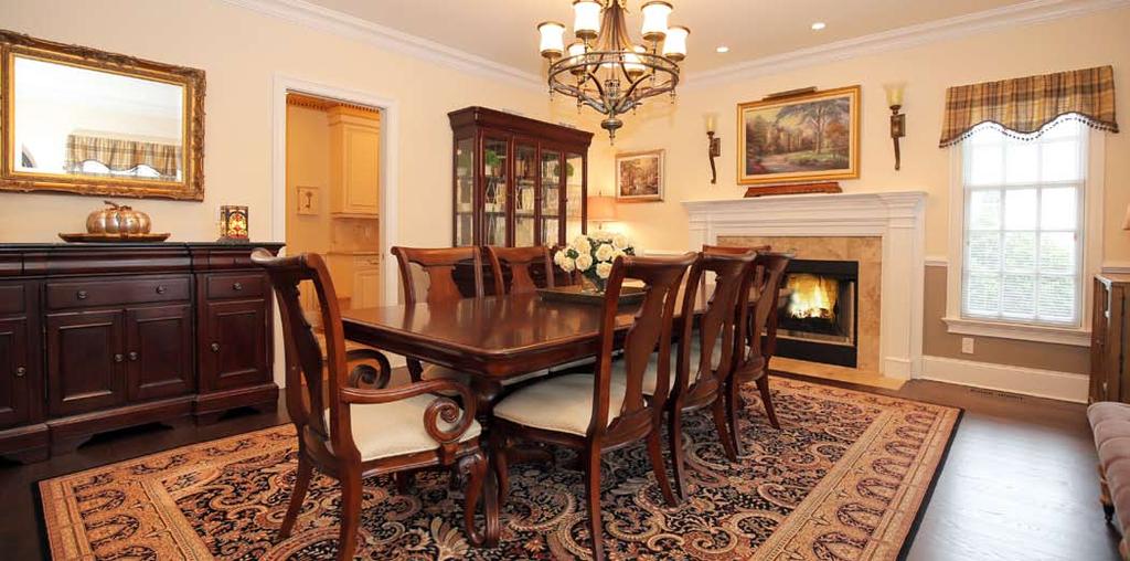 Dining Room First Level Grand Two Story Entrance Hall with tray ceiling, 2 coat closets, huge Tiffany chandelier, straight staircase to 2nd Floor Living Room with chair rail, gas fireplace with
