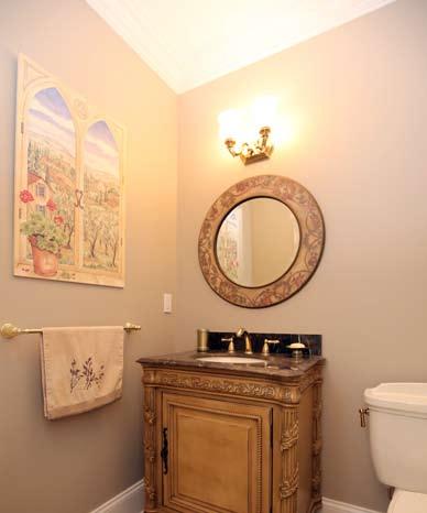 Family Room Powder Room Full Bath with Toto commode, mirror and lighting fixture over sink with Brass faucet set in quartz countertop over custom vanity, one window with blinds and a valance, shower