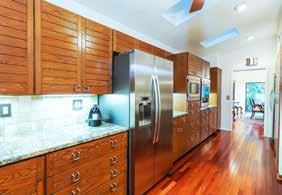 KITCHEN Size: 22 x 9 8 Cathedral ceiling with skylights Ceiling fan Custom, solid-wood cabinetry with softclose glides and hinges