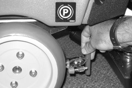 OPERATION 1. Release the parking brake (Figure 6). FIG. 6 2. Turnthekeyandthesolutionswitchtotheon(I) position (Figure 7). FIG. 9 To operate the machine in reverse, simply rotate the control grips backwards.