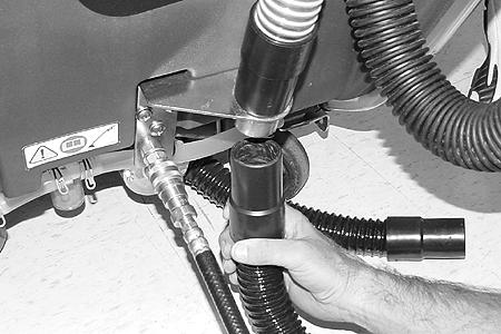 OPERATION 2. Connect the accessory tool s solution hose to the coupler located at the rear of the machine (Figure 15). 3. Lower the scrub head to activate the vacuum suction (Figure 18). FIG.