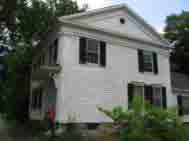 Cladding: Wood clapboard, flush board, or cobblestone. Roof: Moderate pitch, cornice returns, or full pediment gable.