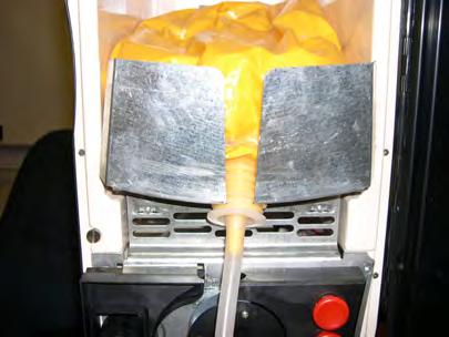 Remove cap from bagged cheese, install new tube, make sure tube is securely seated into new bag of cheese. 2.