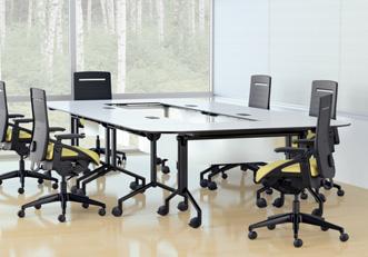 This compact, D-shaped table provides an extra surface for overflow projects, brainstorming sessions,