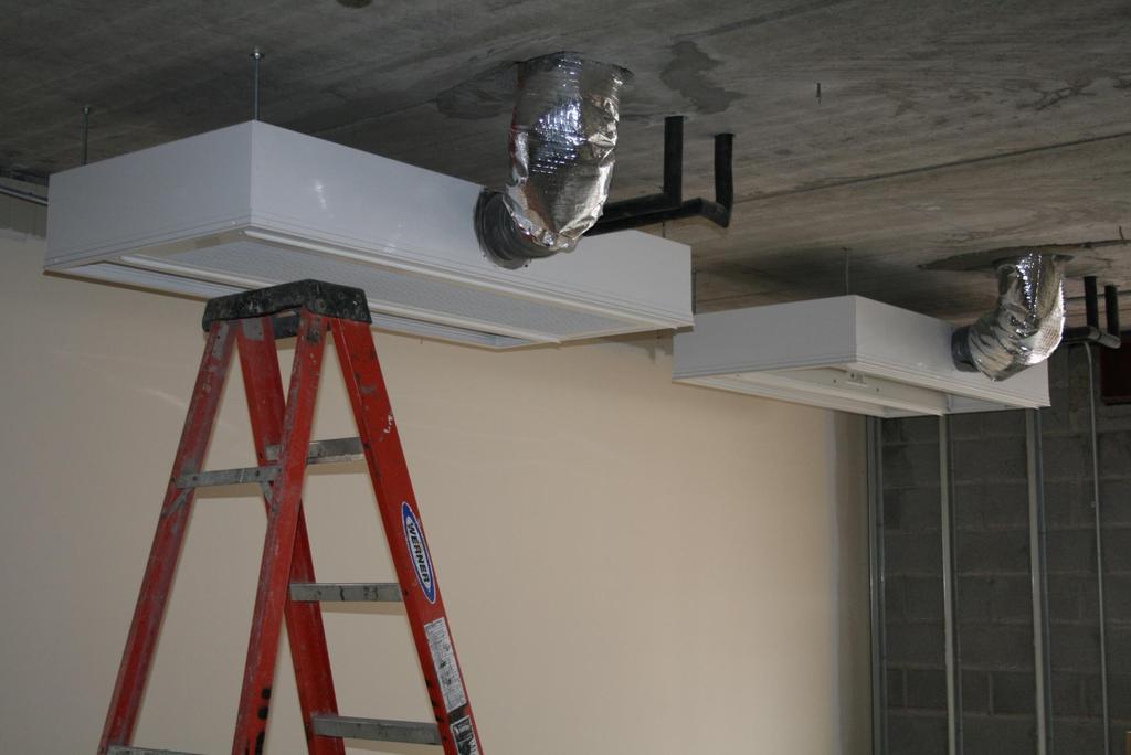 Active chilled beam panels before ceiling installation.
