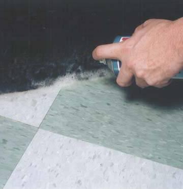 Dust mop entire area; pick up dust and debris and discard. Assemble low speed floor machine with a black Dominator stripping pad; assemble wet/dry vacuum.