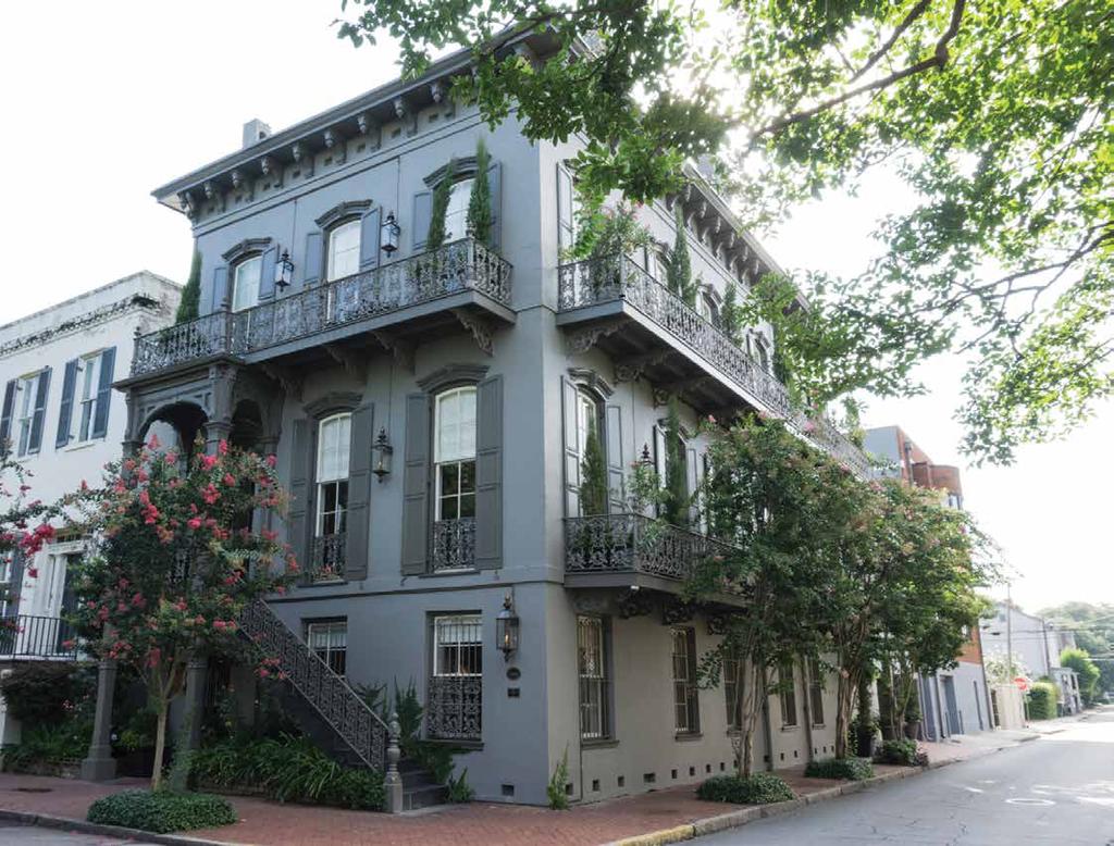 With the ivy gone, the newly restored exterior perfectly embodies the Italianate style which was so popular in the late nineteenth century with wide eaves, tall narrow windows, and large decorative