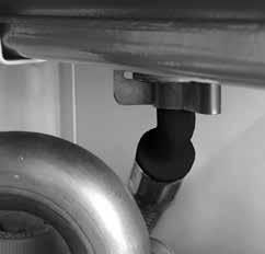 Remove the retaining clip on the vessel water connection pipe. 9. Support the expansion vessel and unscrew the 2 screws from the securing clamp, located on the top of the boiler, and remove.