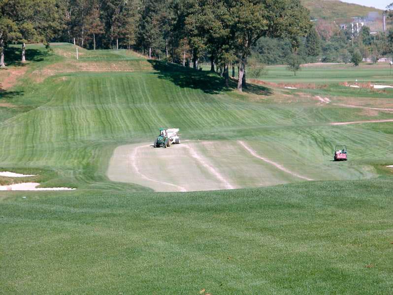 Although large scale sand topdressing operations can be costly, they aid in reducing runoff