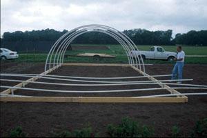 Set hoops at distance for proper support Greenhouse Construction: Setting the Hoops 1.