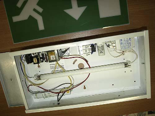 5 The Automatic emergency lighting unit with the cover removed. The control gear can be seen and the rechargeable battery located at the lower left hand side.