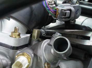 Install air bleed hose and secure it with the clamp.