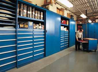 Storage Wall sections featuring different combinations of shelves, drawers and roll-out trays allow the maintenance department at this