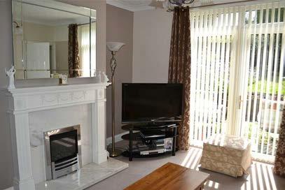 gas fire with marble and brass surround and brass grate, two wall lights. Lounge 15'9 x 13'6 to widest point (4.80m x 4.