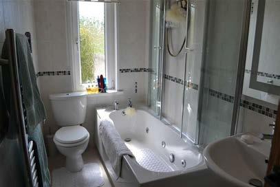 Yorkshire Dales and to Pendle Hill Bathroom Modern 3 piece suite in white with a spa bath and chrome taps, electric
