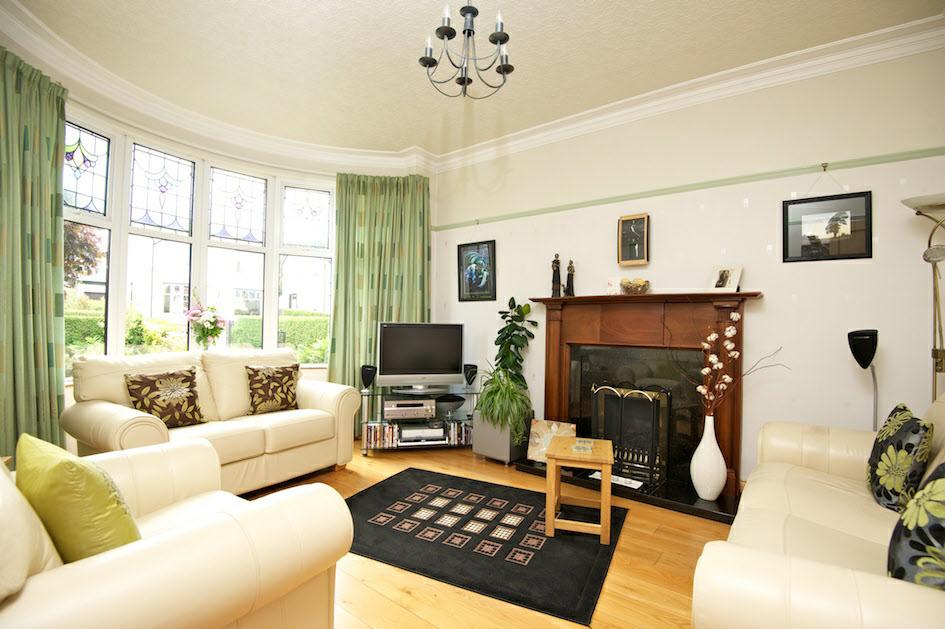 Attractive polished granite fireplace and hearth with oak surround, gas coal effect fire.