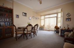 6") A good sized second reception room situated to the rear aspect of the property with a bay window with double glazed patio doors leading into the conservatory, shelving and cupboards to one