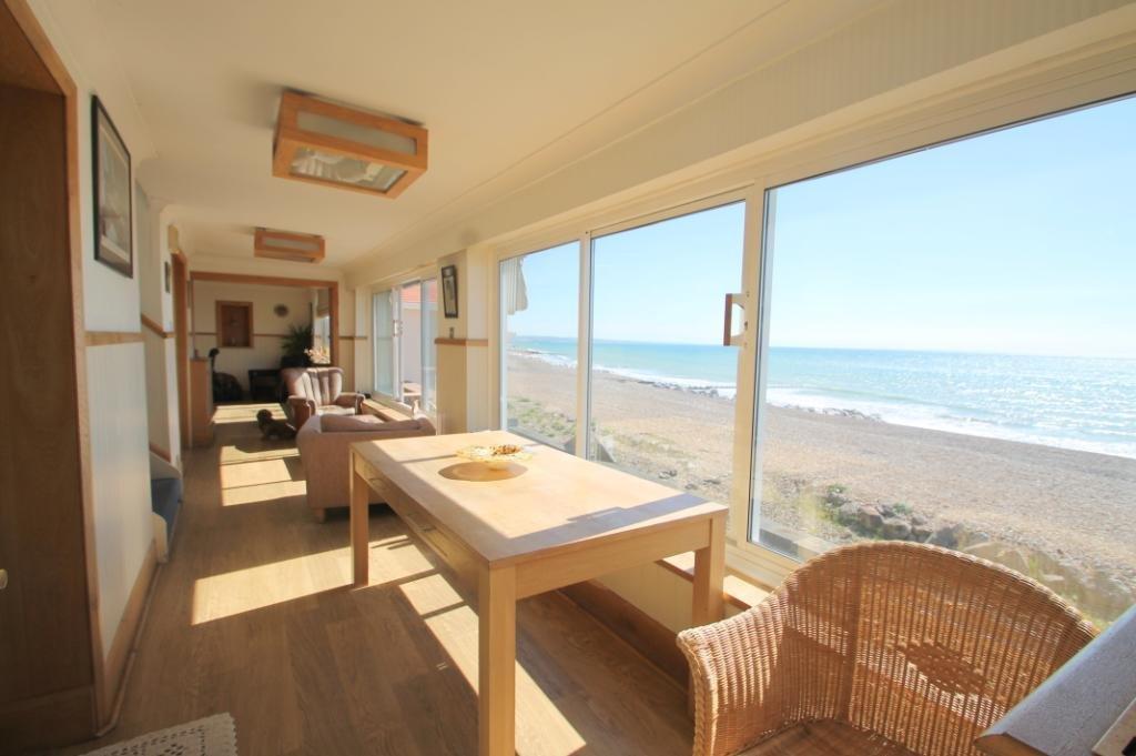 sitting room allowing direct beach and sea views. UTILITY ROOM 9'10" max x 8'1" (3m max x 2.