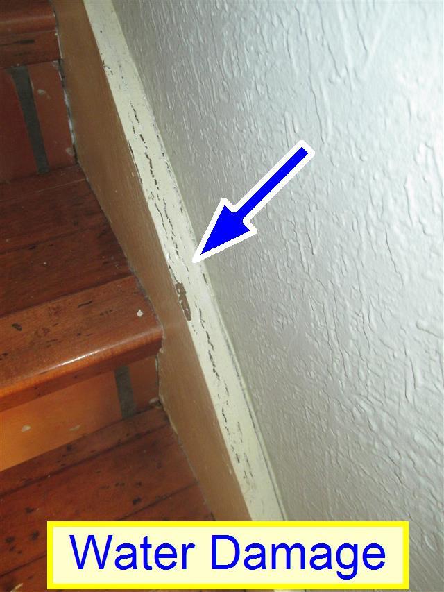 For safety purposes it is recommended that this be altered to meet the standard safety requirements. (4) Water Damage. There was some swelling of the side board at the lower section of stairs.