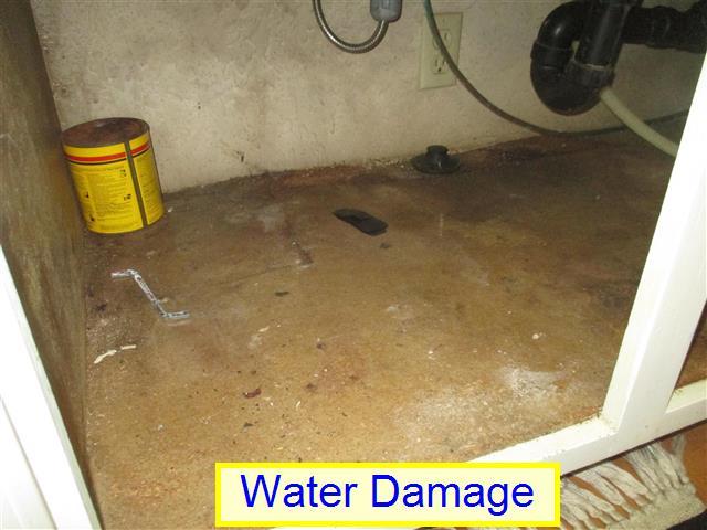 It was noted that a few areas of the kitchen cabinets show some wear at heavily used areas of the cabinet doors. This is noted for your information. (2) Water Damage.