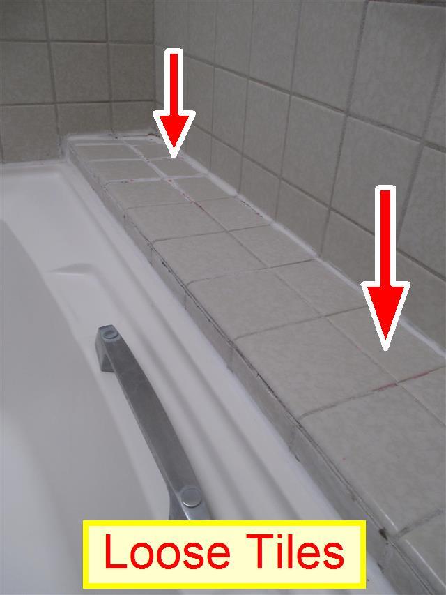 It was noted that there were was a loose or damaged tile in the shower enclosure.
