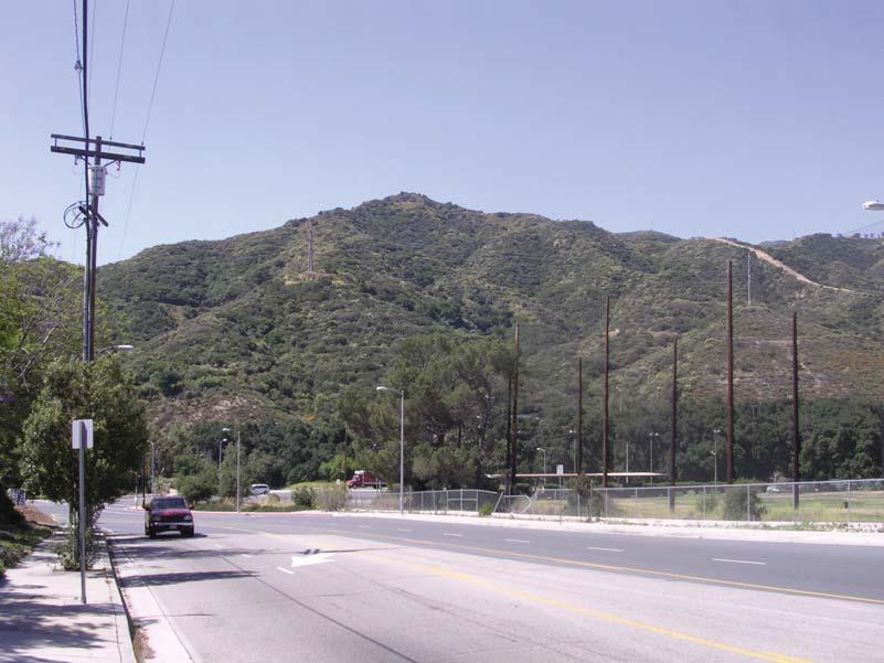 View 3: View looking south along Tujunga Canyon Road toward its intersection with Ta Tuna Canyon Road. The steep open space slopes of the Verdugo Mountains dominate the view from this vantage point.