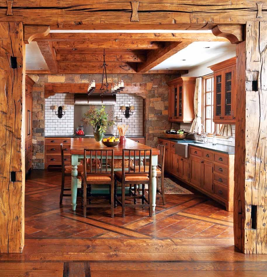 Opposite: Anchored by a traditional farmhouse table, the rustic kitchen is a hub for family activity.